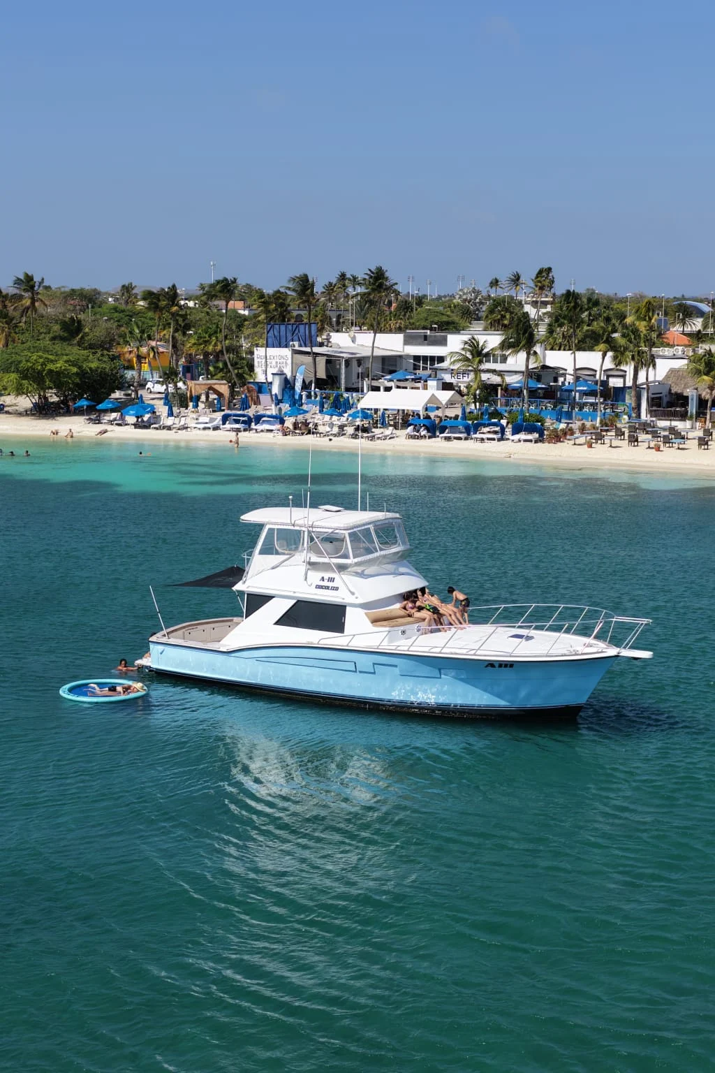 Romantic yacht getaway in Aruba — relaxing on deck near Palm Beach