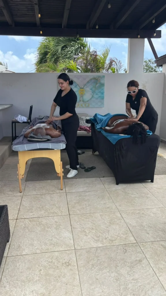 Two massage tables prepared for a group spa session in a villa