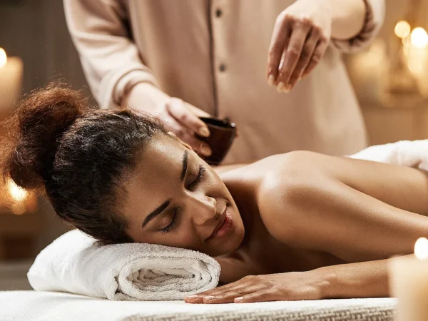 Guest enjoying a candle-lit mobile massage in Aruba