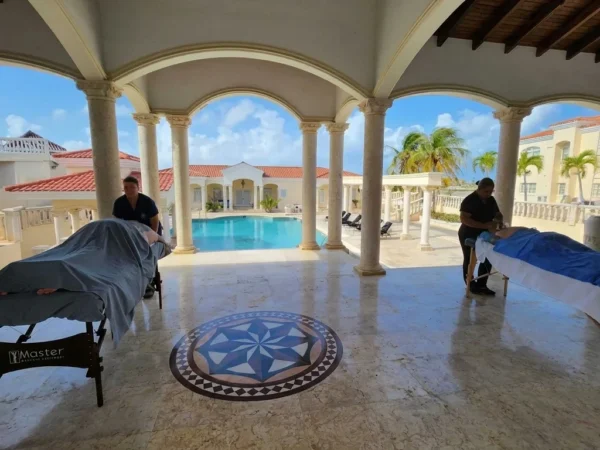 Ocean Reset massage in Aruba beside a villa pool