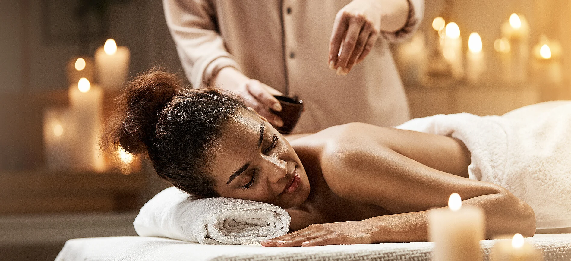 Good Aura massage in Aruba — candlelit signature ritual at your stay