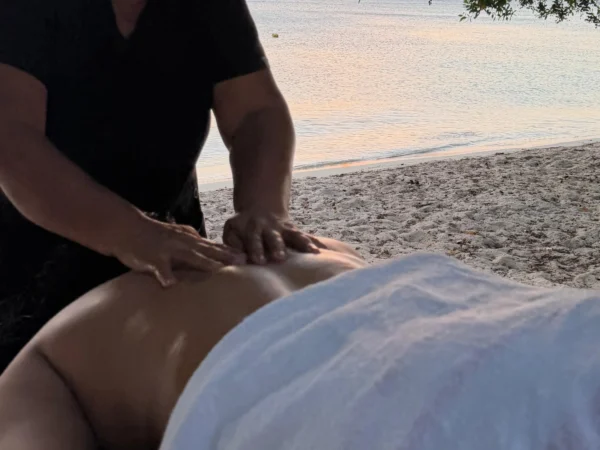 Couples beach massage in Aruba at sunset